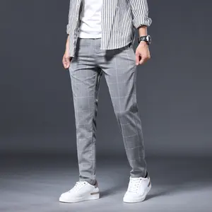 Men's slim-fit dress trousers made of polyester, spandex, and viscose fabric, available in multiple colors (sizes: 28-38).