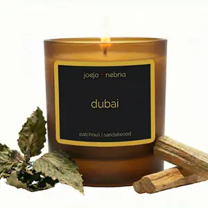 JoeJo + Nebria “Dubai” — A coconut-apricot wax candle with patchouli and sandalwood. Classic, grounding, and earthy. Comes in a vegan, reusable container designed for repurposing.
