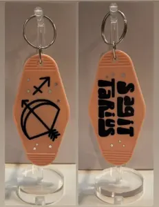 SAGITTARIUS Zodiac Stars Retro Motel Peach Black Keychain