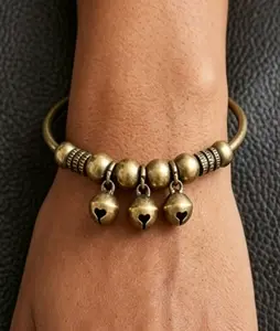 A stylish vintage red bell bracelet featuring an adjustable design. Its crisp, soothing chime makes it perfect for daily wear—and the ideal gift for a friend.