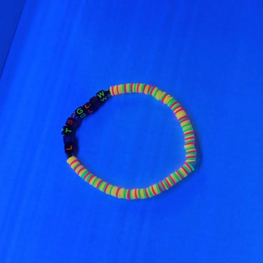 Neon Lets Glow Bracelet - Colorful Bead Design Against Blue Background