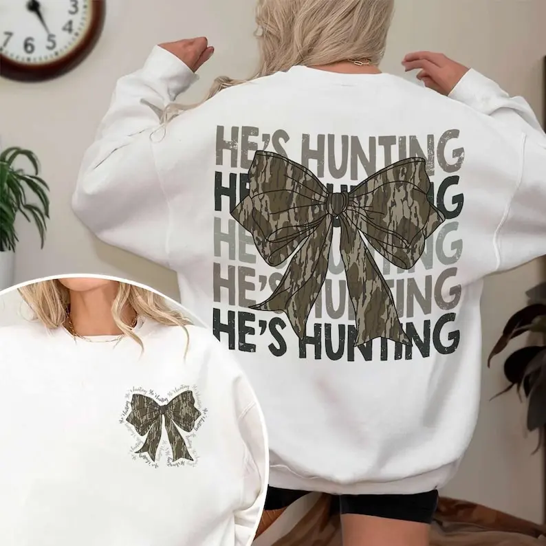He’s Hunting Camo Coquette Bow Shirt, He's Hunting Camo Shirt, Hunting Season Gift, Girls Camo Bow Shirt, Gift For Her, Sweatshirt For Everyone