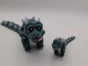 Derpy the Dino – Flexi Dinosaur Fidget Toy A wiggly articulated dinosaur desk toy for stress relief and anxiety relief. 3D printed in PLA with smooth flexi joints. Great collectible animal figure and fidget. Mini and standard sizes.