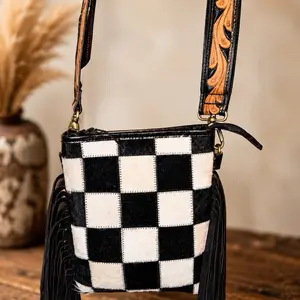 Black and White genuine cowhide fringe bag with a tooled crossbody strap