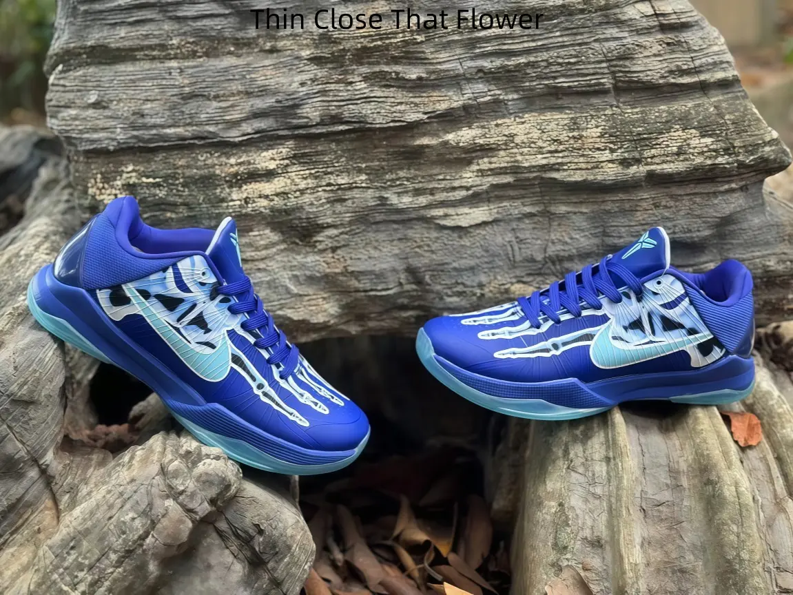 Deep Royal Blue With Pale Cyan Skeleton Art Lace Up Low-profile Court Sneakers, Tapered Aerodynamic Silhouette, Reinforced Heel Lock For Casual Basketball Lovers