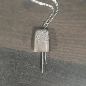 Bell Pendant necklace with Floral Design