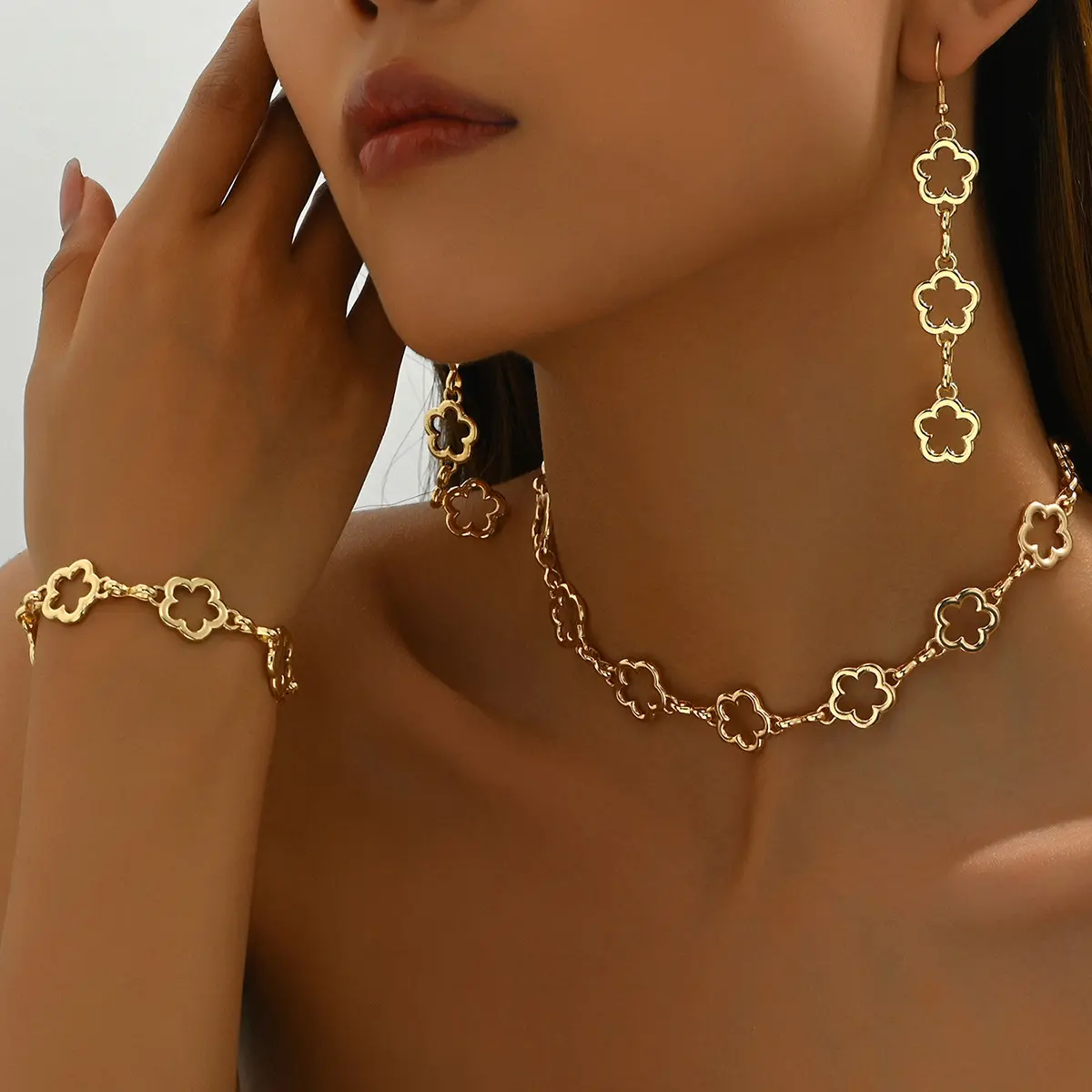 Unique Japanese and Korean style women's bracelet jewelry set with floral plum blossom design, long necklace and tassel earrings