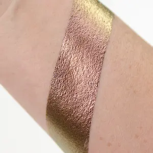 Phoenix Cream Liquid Eye Shadow with Shifts of Gold, Copper, and Purple