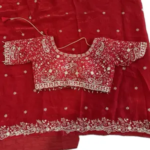 Traditional worked organza saree with matching blouse of size 40 inch bust size.