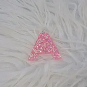 Letter Keychains made with Epxoy- Colors and Glitter may vary