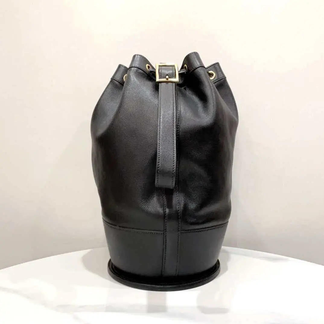 Pre-owned HERMÈS Hermes Vintage Black and Gold Bucket Bag Classic Design with Gold Hardware and Sleek Black Leather