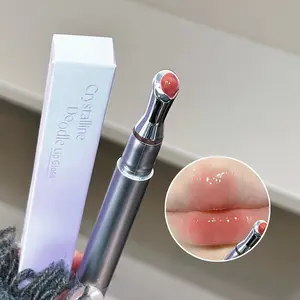 Plumping Lip Gloss with Metal Applicator, infused with moisturizing formula, lightweight texture, high-shine glass finish, long-lasting non-transferable, ideal for lip plumping and daily lip care.