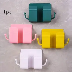 1pc Wall Mounted Mobile Phone Holder Punch Free Storage Box TV Remote Control Cell Phone Plug Charging Support Phone Stand