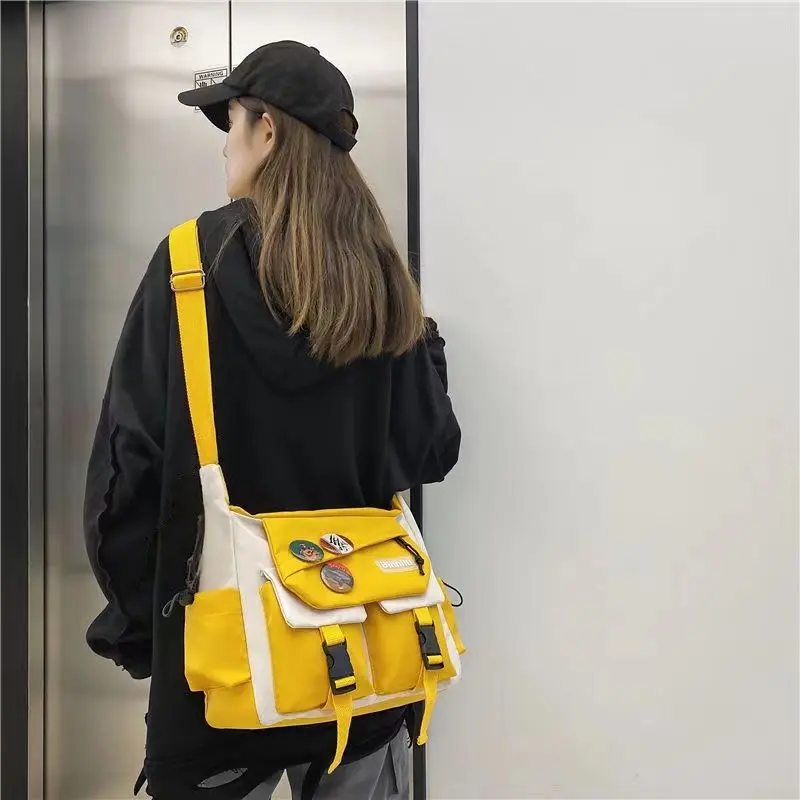 Crossbody Messenger Bag with Pin Display, Multi-Compartment Utility Shoulder Bag, Large Capacity Satchel for Travel, Work, and Outdoor Activities(with accessories) ﻿