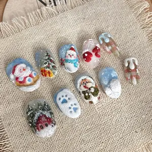 Festive Christmas Nails Medium Almond Fake Nails with Tree Snowman Forest House Designs Fully Covered Glue for Women's Nail Art 24 Cute Christmas Themed Designs
