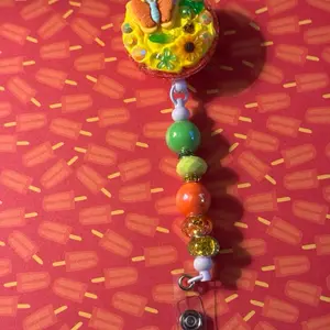 Butterfly & Sunflower Badge Reel with Colorful Beads and Adjustable Clip for Easy Attachment