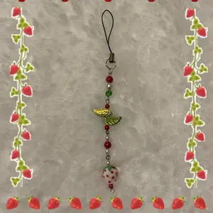 Handmade White Strawberry Phone Charm or Keychain Accessory with Fruit and Leaf Charms, Includes Beads and Decorative Elements