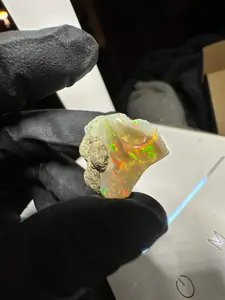 Jewelry Grade Ethiopian rough with clear white base and red/green play of color Opal
