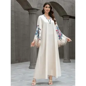 Elegant Arabian Jilabiya dress with a V-neck, embellished print, fringe, and long sleeves; fitted geometric design suitable for all seasons; floral-embellished abaya; embroidered abaya