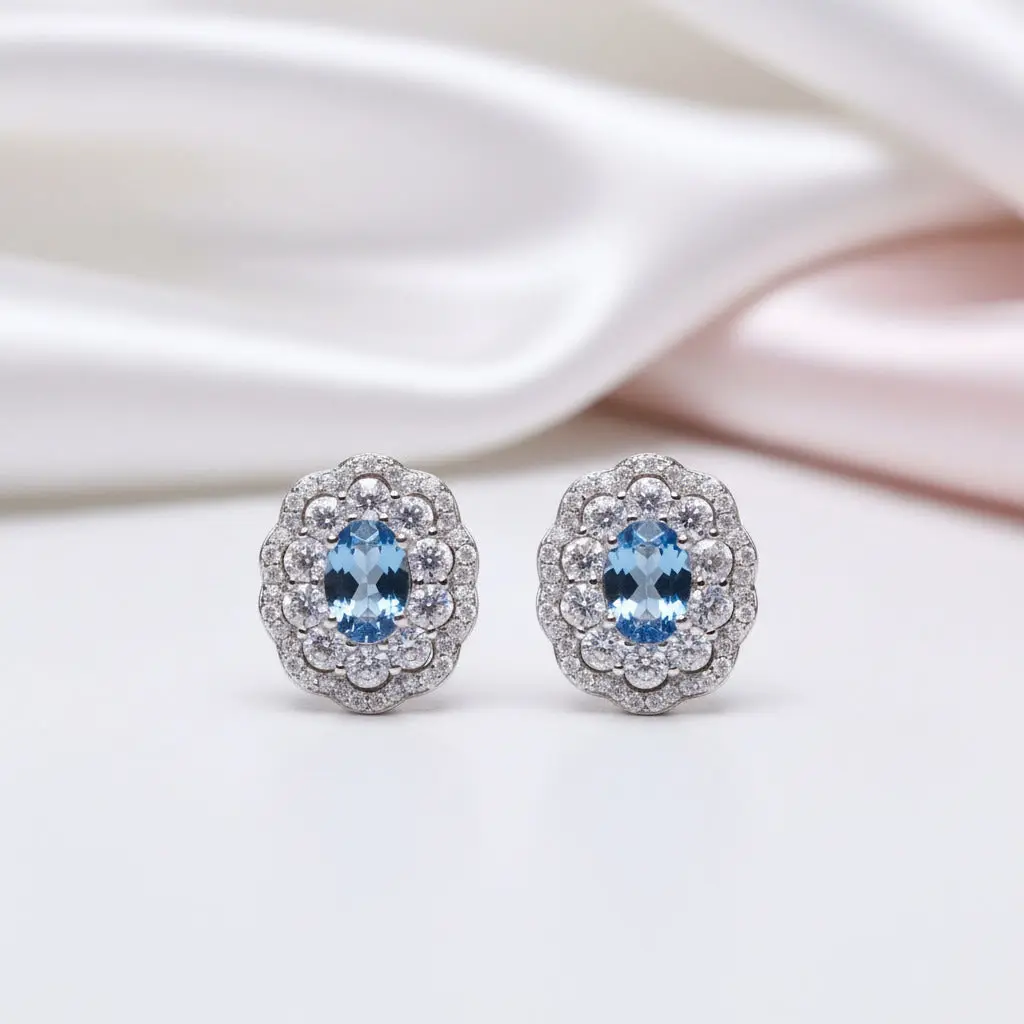 Oval Cut Blue Topaz Stud Earrings
