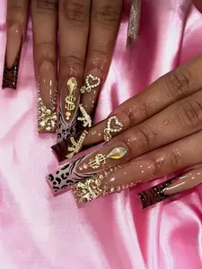 A Set Of 24 Long Press-On Nails With Shiny Gold Rhinestones, Heart And Butterfly Pattern. Comes With Jelly Glue And Nail File. Suitable For All Ladies To Match With Daily Wear And Make Fingertips More Charming.
