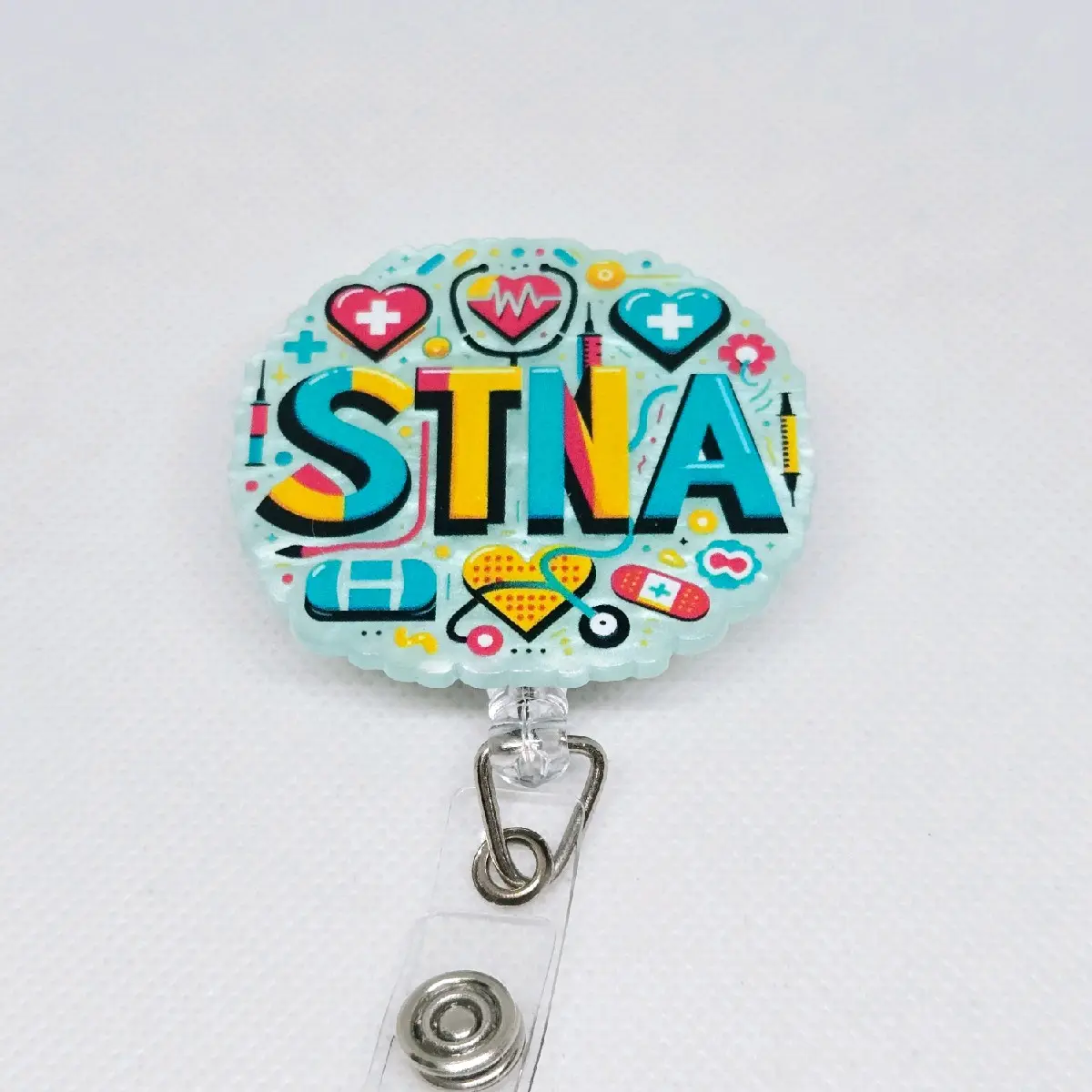 STNA State Tested Nursing Assistant Acrylic Retractable Badge with Alligator Clip, Features Heart and Pillow Design identification supply hospital worker