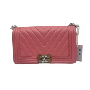 Pre-owned CHANEL HZ8 Le Boy Medium V Shaped Quilted Handbag in Hot Pink, smooth lambskin, with a bright silver palladium double C clasp and a silver leather chain strap. 70865
