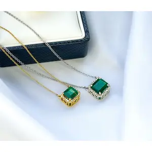 Emerald Cut Emerald Halo Diamond Necklace in 14k Gold