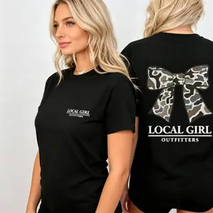 Coquette Bow Camo Tee – Pretty meets bold.The oversized tee that steals the scene, softly.  tiktok shop deals    graphic tee Piece Feminine