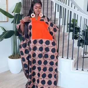 The Rich Auntie Dress - Casual Womenswear with Polka Dot Pattern and Orange Accents