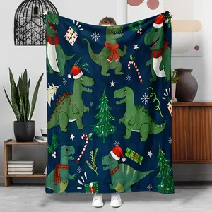 A Christmas-Themed Dinosaur Blanket Featuring A Deep Blue/Red Base With A Green Dinosaur Wearing A Santa Hat And Scarf, Along With Christmas Elements Like Trees, Gifts, Candy Canes, And Snowflakes