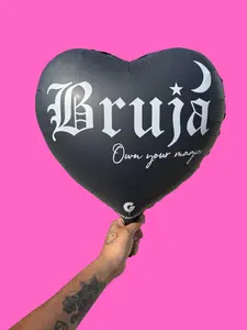 Bruja Own Your Magic Globito 18 inch heart shape balloon translates to Wich Own your magic