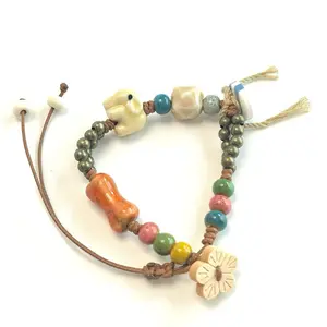 Whimsical Bracelet Wood Button Flower Tan Elephant boho cord adjustable