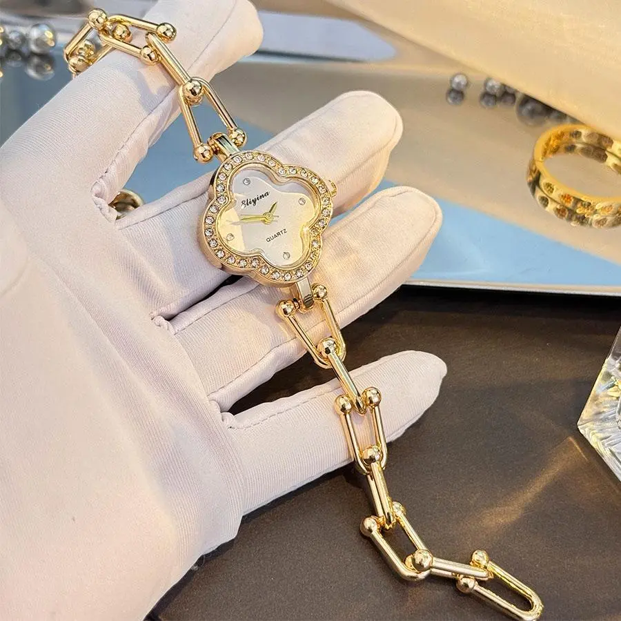 Clover Design Women's Watch with Gold Chain and Gem-Studded Bezel
