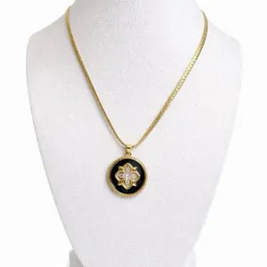 Gold and Black Pendant Necklace with Intricate Design and Elegant Chain for Women