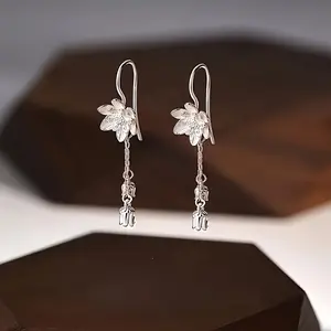 A pair of stylish lotus tassel earrings for women, suitable for everyday wear, spring and summer, graduation gifts, and celebratory occasions.