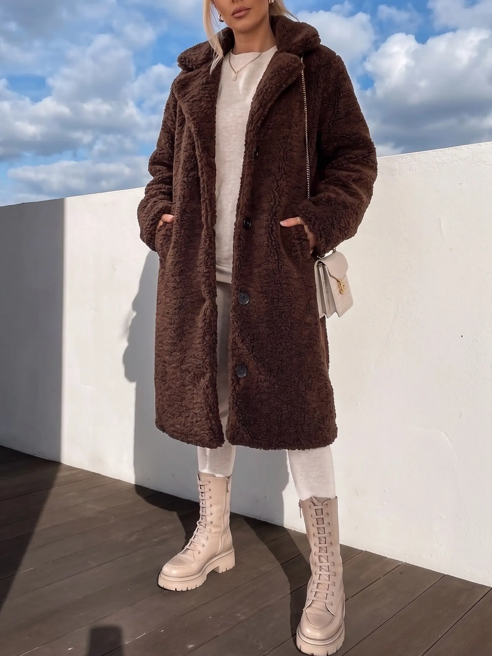Stay warm and chic!  Women's Button-Down Long Coat for the ultimate winter aesthetic. Perfect cozy outerwear for chilly days.