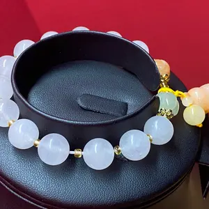 Women's White Jade Bracelet featuring Yellow Jade Trumpet Flower Charm