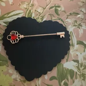 Gold Key Industrial with Red Gemstone and Decorative Design