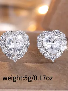 A pair of stylish synthetic oxidized heart-shaped red diamond stud earrings, elegant, luxurious, and trendy in an Instagram-worthy style, perfect for women, High quality earrings, Stud Earring Jewelry