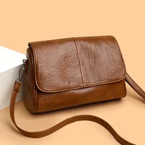 A vintage-style solid color crossbody bag, with a magnetic flap closure design, simple and solid color, adjustable shoulder strap, suitable for daily use and commuting. Large capacity, multiple pockets, crossbody and shoulder bag for women