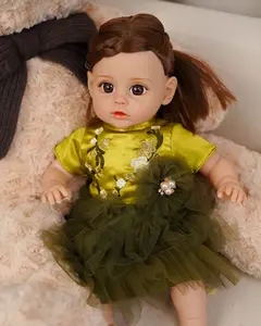 VACOS 14inch Reborn Baby Doll: Features a cozy cotton form, elegant olive gown with embroidered blooms, meticulous braiding, deep brown irises, and textured creases for natural posing—great as holiday surprises or childhood companions!
