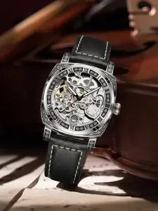 Gold automatic mechanical men's watch, with a hollow-carved skull dial, Roman numerals and world time function - a luxurious round watch suitable for both casual and formal occasions