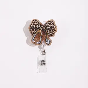 Adjustable lanyard with a leopard-print bow design and a clear ID card holder; ideal for nurses and doctors; features a stethoscope-shaped clip