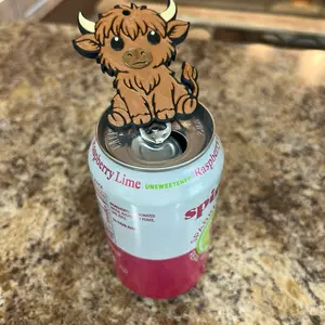 Highland Cow Nail Saver helps while opening soda cans