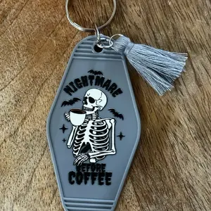 Nightmare Before Coffee Motel Style Keychain with Skeleton Design and Tassel Detail