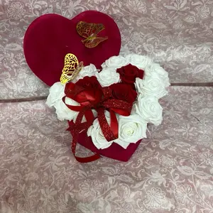 15 preserved roses in the heart shape box  .