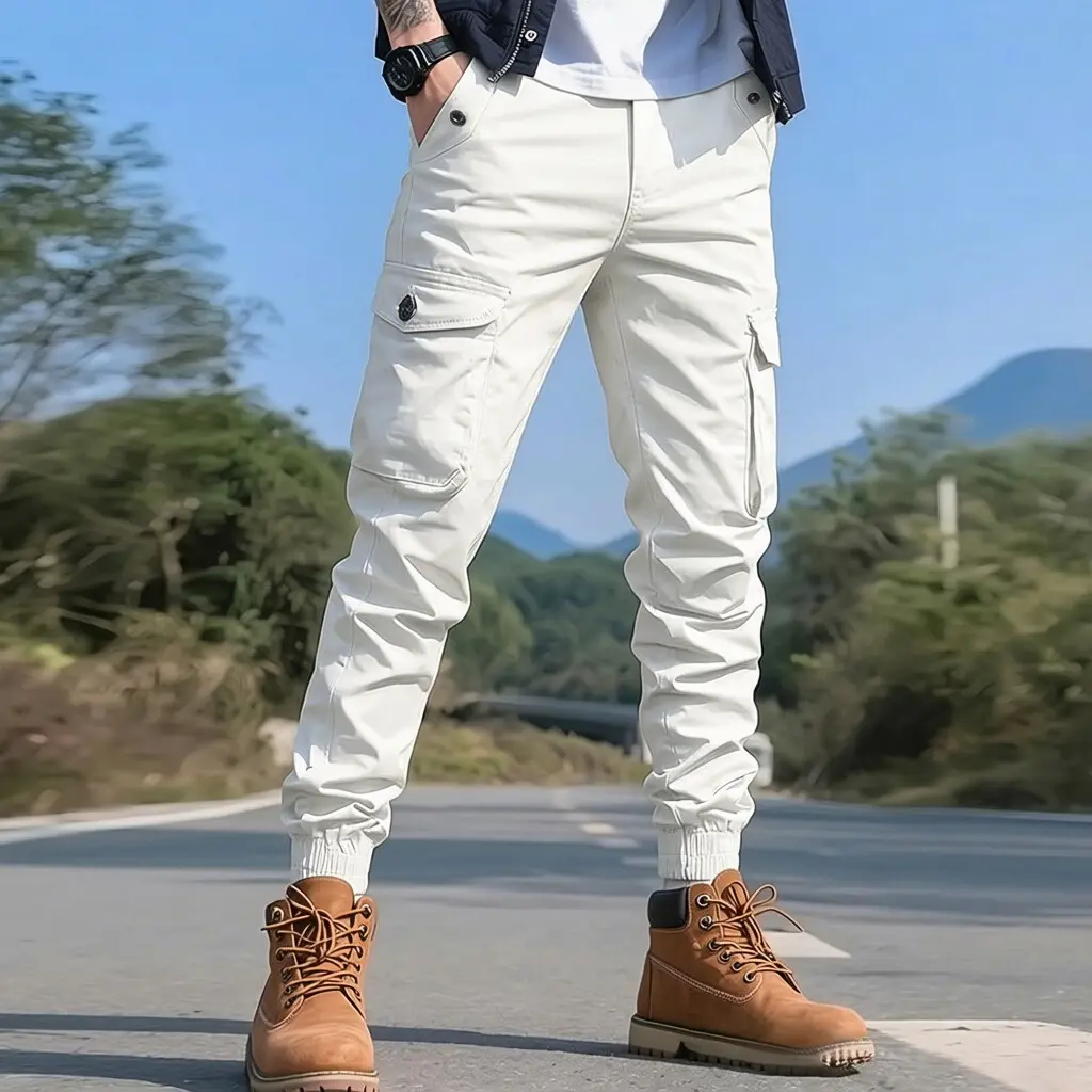 American workwear-style men’s jogger pants, available in multiple colors; slim fit with multiple pockets for outdoor hiking and fishing, elastic waistband with drawstring, casual long pants.