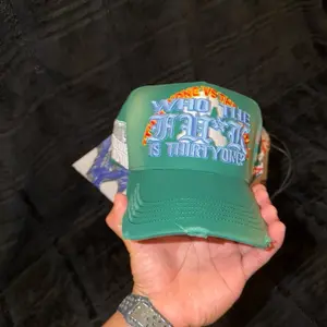 31 Hats Green Trucker Hat with "Who The Hell Is Thirty One" Embroidery for Casual Wear