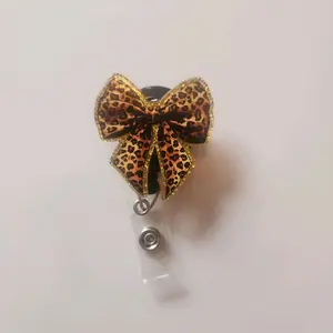 Leopard Print Bow Badge Reel with Gold Trim and Clear Plastic Holder